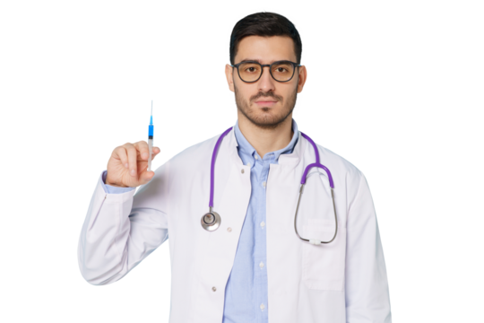 Male doctor looking at camera with serious face, holding syringe with needle up, getting ready to do injections and cure patients