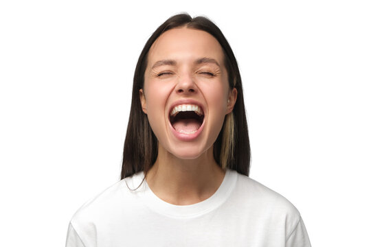 Angry woman, rage concept. Close-up portrait of screaming with closed eyes crazy young female