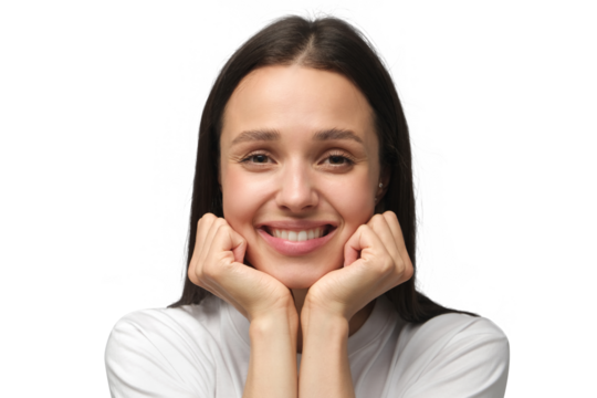 Young kind woman with head resting on fists, smiling warmly and friendly while listening to her mate with care and attention