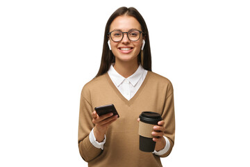 Young woman looking at camera while holding phone in one hand and coffee cup in another