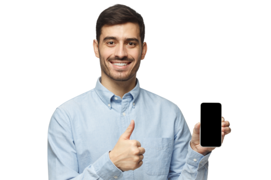 Happy young man holding blank phone screen, smiling at camera, showing thumbs up gesture