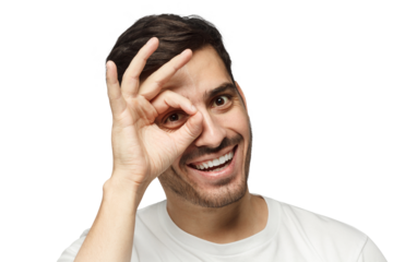 Young man making gesture imitating binoculars