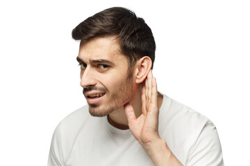 Young man pressing hand to ear trying to hear something better