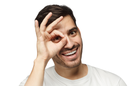 Young man making gesture imitating binoculars