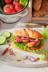 Delicious and fresh sandwich with vegetables and curry chicken.