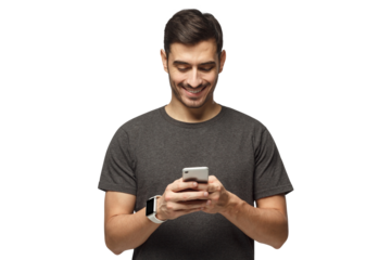 Young man standing, looking at screen of phone with smile, browsing web pages or chatting with friend