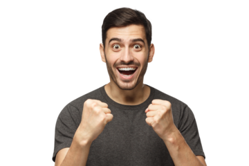 Young man celebrating victory as if he is winner, squeezing fists in deep emotional expression of happiness and luck