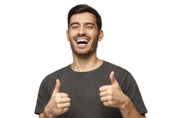 Excited smiling young man making thumbs up gesture of approval and success