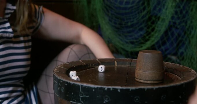 An exciting coconut shell game occurs in a lively setting where participants enjoy and have fun together