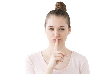 Fototapeta premium Quiet please, silent gesture from a calm woman with a finger on her lips