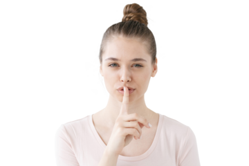 Quiet please, silent gesture from a calm woman with a finger on her lips