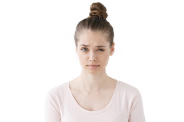 Young female without make up raising eyebrow with vivid expression of suspicion, looking mistrustful towards she is hearing