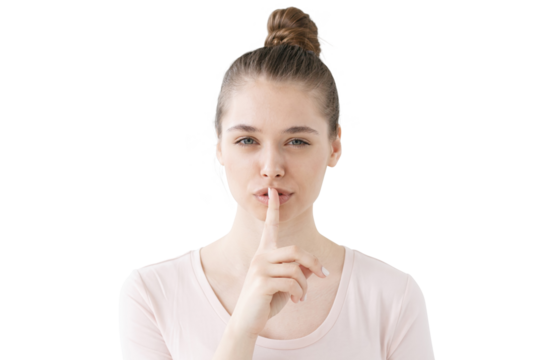 Quiet please, silent gesture from a calm woman with a finger on her lips