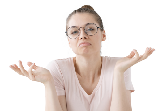 Close-up of emotional young woman showing helpless gesture with arm and hands, mouth curved as if she does not know what to do