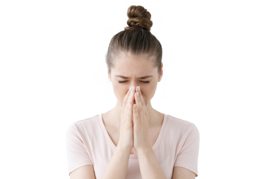 Young european female looking stressed, putting hands together as if she is praying with closed eyes to overcome depression and find solution to problem