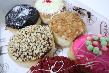 Colorful donuts with a lot of topping