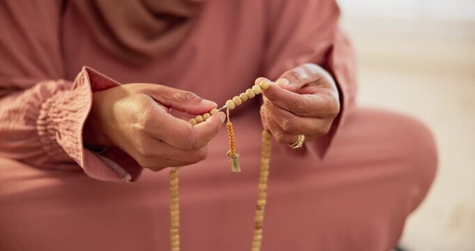 Islamic, beads or hands of person in prayer to God in faith, devotion or worship for Eid or ramadan. Counting closeup, muslim or calm Arabic woman sitting in home for fasting, gratitude or wellness