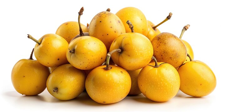 Freshly harvested marula fruits with vibrant yellow skin and brown stems arranged artfully on a clean isolated white background, showcasing their unique texture and shape.
