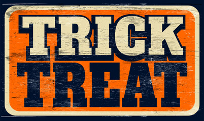 Fototapeta premium Aged retro trick or treat sign on wood