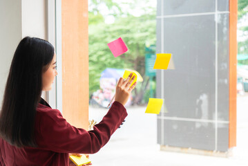 businesswoman taking notes on glass board . Concept of business finances and accounting.