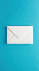 A pristine white envelope lies flat on a bright blue surface