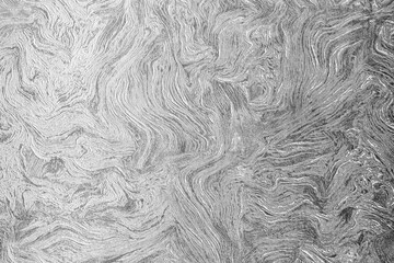 Grey texture of wavy lines.