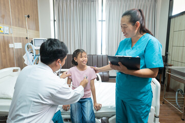 Obraz premium Photo of a doctor examining a little girl with a stethoscope in a clinic.