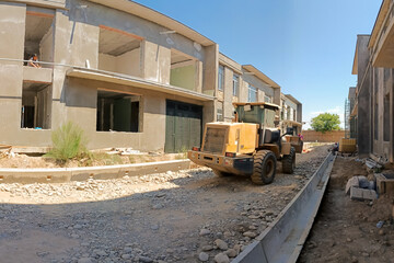 front loader at house construction site