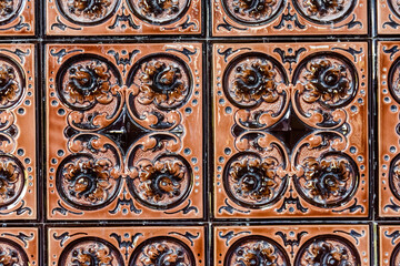 Old vintage ceramic tiles for the decoration stoves and fireplaces. Background, texture
