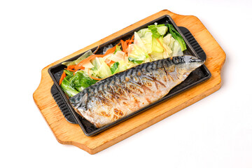 Saba steak in a black pan, paired with ready-to-eat vegetables.