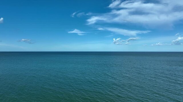 Nature of the beach and sea Summer with sunshine, sandy beaches, clear blue waters sparkling against the blue sky. On an island with good ecology and environment Background for summer vacation concept