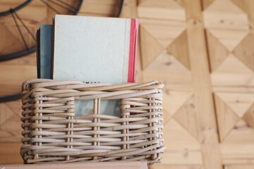 Cozy reading nook with a wooden bookshelf, books, and orange flowers, perfect for literature lovers