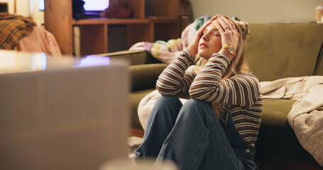 Woman, stress and moving on floor in house with boxes, headache and chaos with clothes in living...