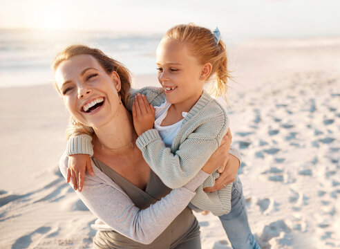 Laughing, mother and child hug at beach with travel, holiday and summer vacation in Florida. Happy, smile and bonding by sea with love, care and support on family trip by ocean with embrace.