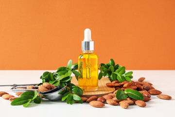 Skin care and body care concept - almonds, almond oil