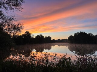A small lake in the early morning during sunrise