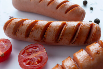 grilled sausages on white background