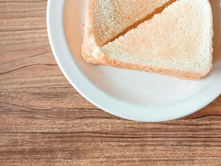 Two perfectly toasted slices of bread, golden brown and crispy on the outside, soft and fluffy on the inside. The perfect way to start a cozy morning.