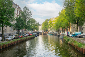 Amsterdam Summer Canal and Parked Boats and Cars