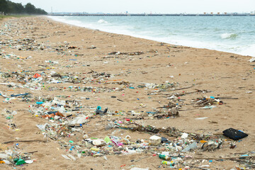Trash Garbage washed up on the beach, Dirty sea beach trash, plastic cups and plastic bags at the beach. environmental ocean and shore problem.