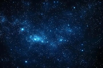 Fototapeta premium A stunning view of a star-filled night sky with twinkling stars scattered across a deep blue expanse.