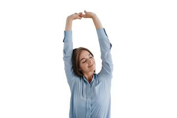 young woman in a blue shirt stretches with closed eyes, enjoying a moment of relaxation,...