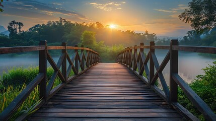 Fototapeta premium View of sunrise, morning mist and wooden bridge