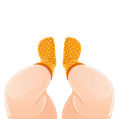 Baby feet in orange polka dot socks isolated on a white background