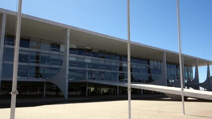 Brazilian and Mercosul flags waving in front of Planalto Palace, headquarters of the Presidency of the Republic of Brazil, in Brasilia