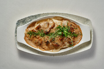 A steaming bowl of traditional Ukrainian varenyky