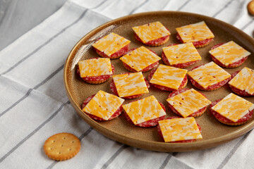 Gourmet Cheese Meat and Crackers on a Plate, side view.