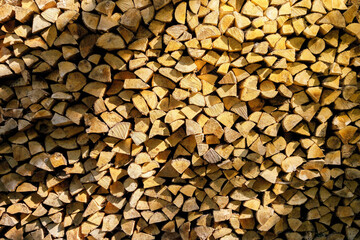 Stack of chopped firewood. Preparation of firewood for the winter heating