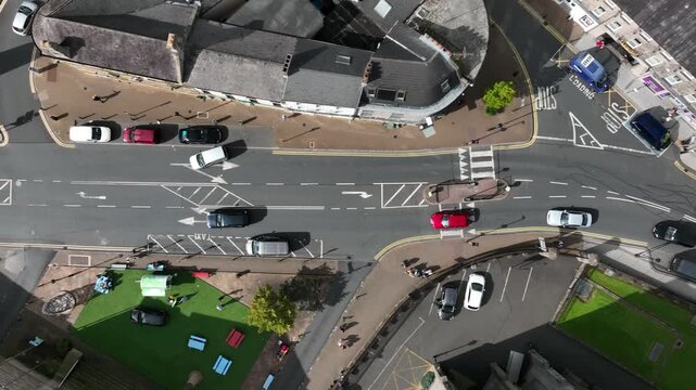 Monaghan Town, County Monaghan, Ireland, September 2022. Drone in Bird's Eye View tracks above Church Square following cars tracking towards the Dawson Monument.