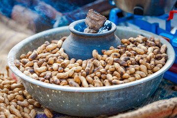 Roasted peanuts prepared in the traditional way at the Pushkar fair in Rajasthan, India.